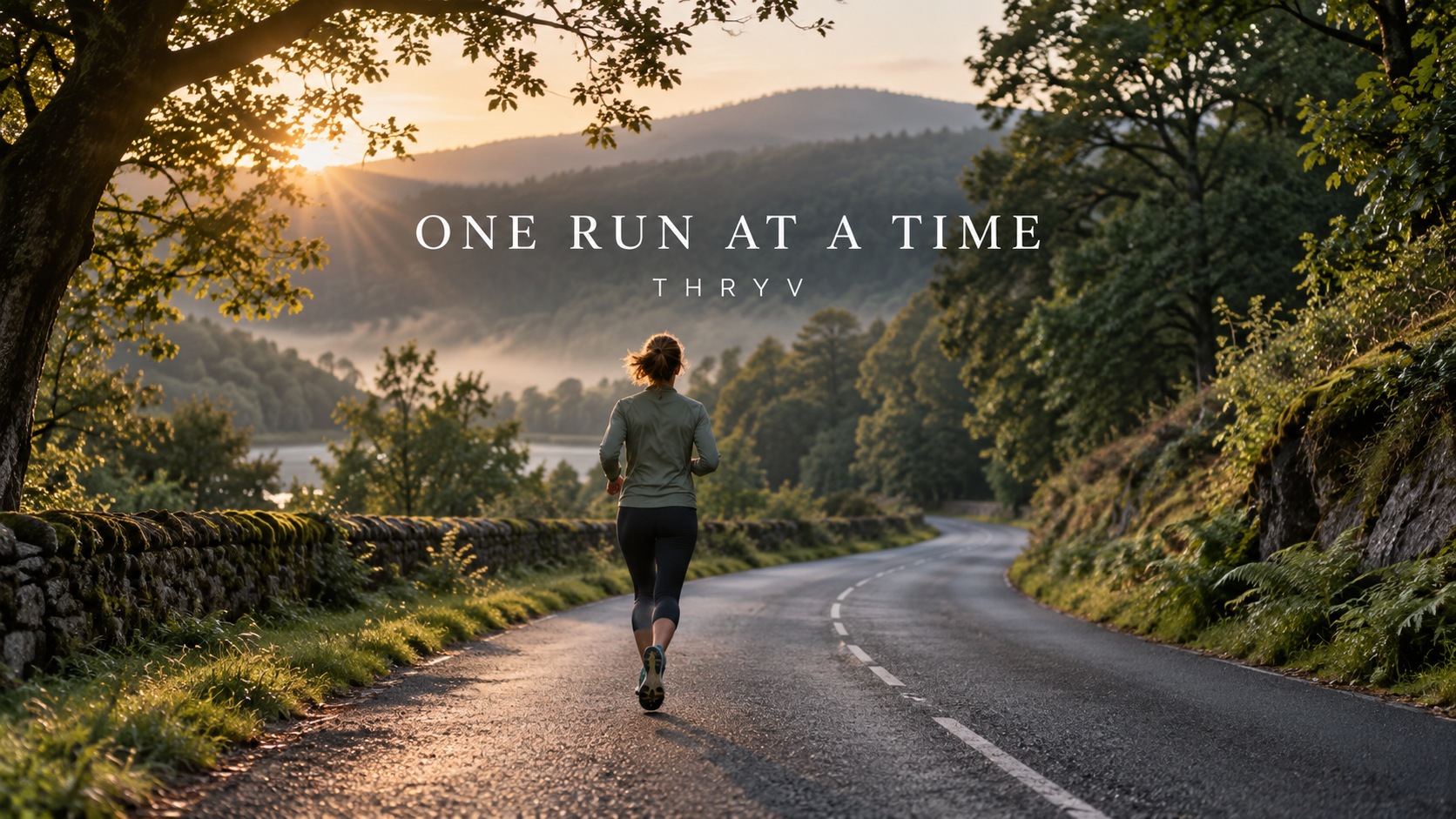 A runner on a winding country road at sunrise, with the words One run at a time.